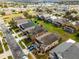 Aerial view of houses, yards, and a neighborhood street at 131 Cadiz Loop, Davenport, FL 33837