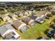 Aerial view of houses with pools and screened enclosures at 131 Cadiz Loop, Davenport, FL 33837