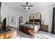 Main bedroom with king-size bed and access to bathroom at 131 Cadiz Loop, Davenport, FL 33837