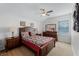 Cozy bedroom with a queen-size bed and ceiling fan at 131 Cadiz Loop, Davenport, FL 33837