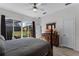 Main bedroom with pool view, walk-in closet, and ensuite bathroom at 131 Cadiz Loop, Davenport, FL 33837