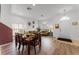 Open concept dining room featuring a wood table and chairs, adjacent to the living area at 131 Cadiz Loop, Davenport, FL 33837