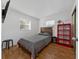 Cozy bedroom featuring a wood bed frame and hardwood floors at 136 Alhambra Ave, Altamonte Springs, FL 32714