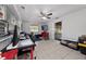 Multi-purpose room with desk workspace and sliding door access to backyard at 136 Alhambra Ave, Altamonte Springs, FL 32714