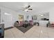 Bright living room with sectional sofa, coffee table, and tile floors at 136 Alhambra Ave, Altamonte Springs, FL 32714