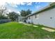 Landscaped backyard with covered patio and spacious yard at 136 Alhambra Ave, Altamonte Springs, FL 32714