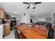 Kitchen dining area with wood table and four black chairs at 136 Alhambra Ave, Altamonte Springs, FL 32714