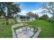 Large backyard with covered patio and grassy area at 136 Alhambra Ave, Altamonte Springs, FL 32714