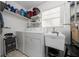 Laundry room with washer, dryer, and utility sink at 136 Alhambra Ave, Altamonte Springs, FL 32714