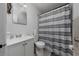 Simple bathroom with gray striped shower curtain at 136 Alhambra Ave, Altamonte Springs, FL 32714