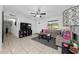 Living room with gray sectional sofa and view into kitchen area at 136 Alhambra Ave, Altamonte Springs, FL 32714