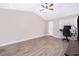 Spacious bedroom with ceiling fan and wood-look floors at 1423 Farrindon Cir # 1423, Lake Mary, FL 32746
