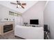 Living room with fireplace, vaulted ceiling and patio access at 1423 Farrindon Cir # 1423, Lake Mary, FL 32746