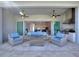 Outdoor kitchen with stainless steel appliances and seating area at 15049 Canopy Cover Dr, Winter Garden, FL 34787