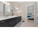 Bathroom with double vanity and large mirror at 15049 Canopy Cover Dr, Winter Garden, FL 34787