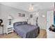 Serene bedroom with queen bed, en-suite bathroom access, and plenty of light at 2216 Mystic Ring Loop, Poinciana, FL 34759