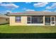 Back exterior view of house and yard at 2216 Mystic Ring Loop, Poinciana, FL 34759