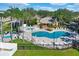 Community pool and spa with plenty of lounge chairs at 2216 Mystic Ring Loop, Poinciana, FL 34759