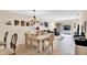 Light and airy dining area with a chandelier and seating for six at 2216 Mystic Ring Loop, Poinciana, FL 34759