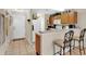 Kitchen features a breakfast bar and light wood cabinets at 2216 Mystic Ring Loop, Poinciana, FL 34759