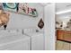 Laundry room with washer, dryer, and shelving at 2216 Mystic Ring Loop, Poinciana, FL 34759