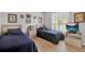 Twin bedroom with two beds, plenty of space, and updated flooring at 2216 Mystic Ring Loop, Poinciana, FL 34759