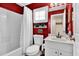 Clean bathroom with a tub, toilet and vanity at 2216 Mystic Ring Loop, Poinciana, FL 34759