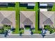 Three villas viewed from above with green lawns at 2216 Mystic Ring Loop, Poinciana, FL 34759