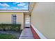 Inviting exterior with a white door and well-maintained landscaping at 2216 Mystic Ring Loop, Poinciana, FL 34759
