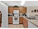 Efficient kitchen with ample counter space and wood cabinets at 2216 Mystic Ring Loop, Poinciana, FL 34759