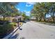 Gated community entrance with landscaping at 2216 Mystic Ring Loop, Poinciana, FL 34759