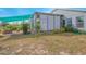 Private backyard patio with covered seating area and lush landscaping at 2649 Sunset Cir, Lake Wales, FL 33898