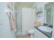 Bathroom with gray tile, white vanity, and shower/tub combo at 2649 Sunset Cir, Lake Wales, FL 33898