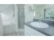 Bathroom with a large vanity, walk-in shower, and tub at 2649 Sunset Cir, Lake Wales, FL 33898
