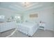 Bedroom with a queen bed, dresser, and decorative wall art at 2649 Sunset Cir, Lake Wales, FL 33898