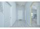 Bright entryway with gray walls, wood-look flooring, and chandelier at 2649 Sunset Cir, Lake Wales, FL 33898