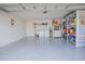 Garage with washer, dryer, and ample storage shelving at 2649 Sunset Cir, Lake Wales, FL 33898