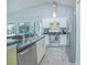 Modern kitchen with stainless steel appliances and a breakfast bar at 2649 Sunset Cir, Lake Wales, FL 33898