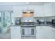 Modern kitchen with white cabinets and stainless steel appliances at 2649 Sunset Cir, Lake Wales, FL 33898