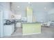 Modern kitchen with white cabinets, stainless steel appliances and an island at 2649 Sunset Cir, Lake Wales, FL 33898