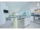 Modern kitchen featuring stainless steel appliances and an island at 2649 Sunset Cir, Lake Wales, FL 33898