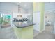 Modern kitchen with stainless steel appliances and a breakfast bar at 2649 Sunset Cir, Lake Wales, FL 33898