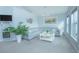 Light-filled living room, featuring a sectional sofa and large window at 2649 Sunset Cir, Lake Wales, FL 33898
