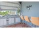 Outdoor kitchen with grill and bar seating at 2649 Sunset Cir, Lake Wales, FL 33898