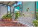Relaxing patio area with white bench and lattice screens at 2649 Sunset Cir, Lake Wales, FL 33898
