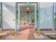 Brick patio with lattice screens, creating a shaded outdoor dining area at 2649 Sunset Cir, Lake Wales, FL 33898