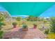 Brick patio with shade sail and potted plants at 2649 Sunset Cir, Lake Wales, FL 33898