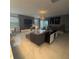 Spacious living room with a large sectional sofa, modern decor, and ample natural light at 2737 Nottel Dr, Saint Cloud, FL 34772