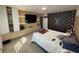 Bedroom with Louis Vuitton wall and large bed at 2737 Nottel Dr, Saint Cloud, FL 34772