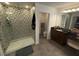 Bathroom with walk-in shower, patterned tile, and vanity at 2737 Nottel Dr, Saint Cloud, FL 34772